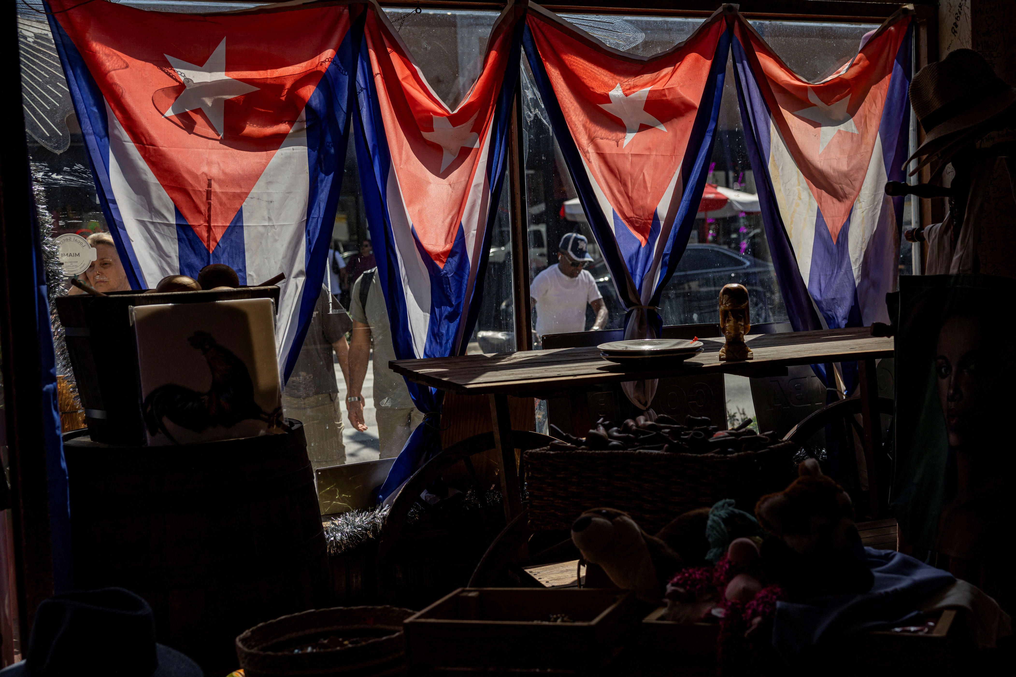 Cuban flags hang inside a store along Calle Ocho in the Little Havana neighborhood in Miami, Florida, U.S., February 27, 2026. REUTERS/Eva Marie Uzcategui