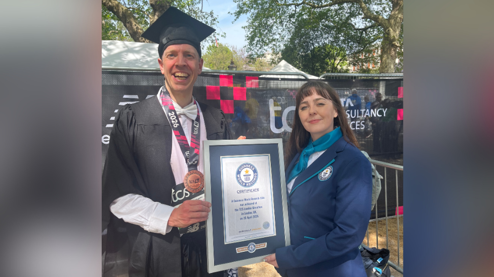Oxford professor sets marathon record in academic dress
