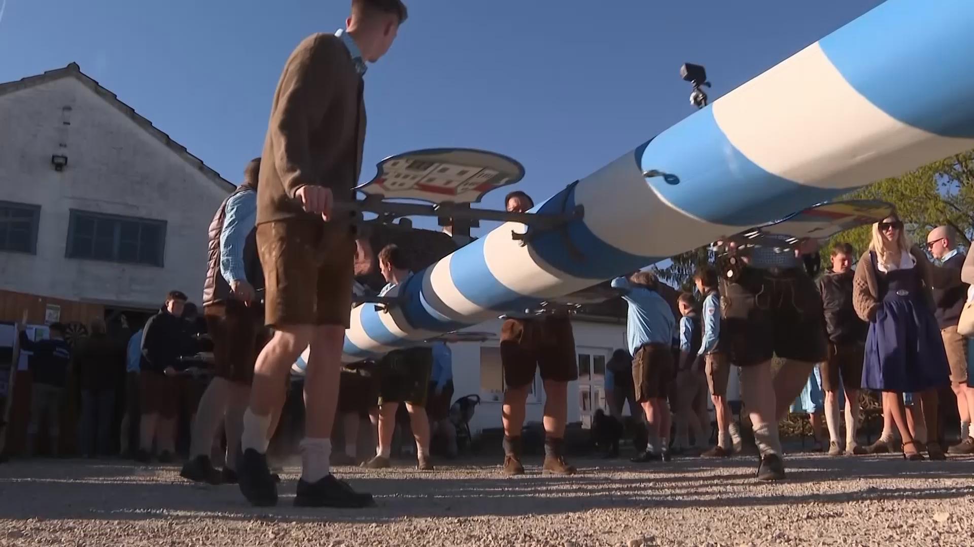 Beer, brass and 'Hau-Ruck' shouts as a Bavarian village raises its new ...