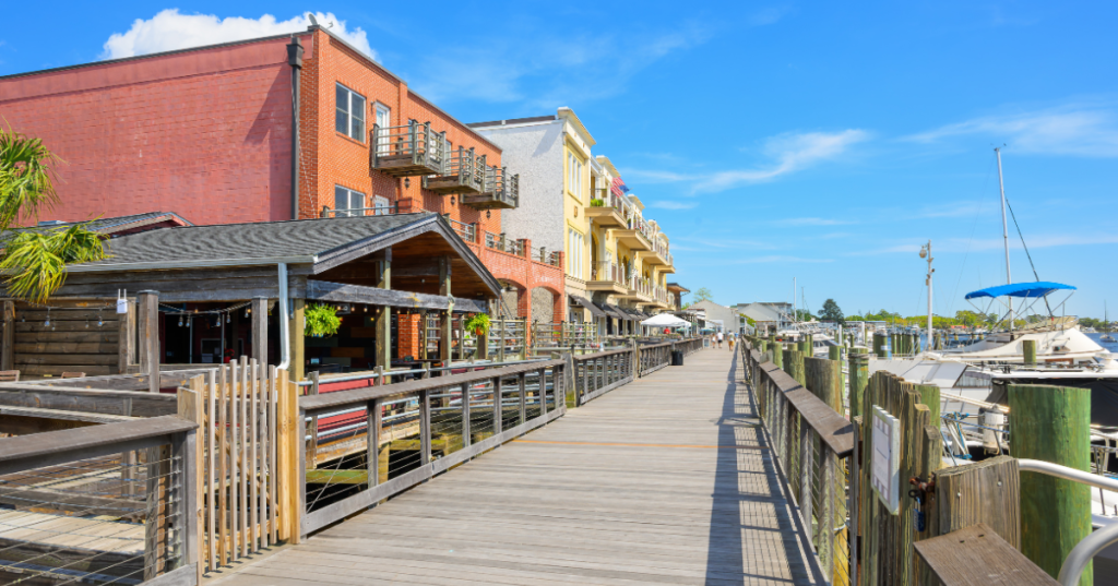 the harborwalk boardwalk runs past a marina and historic buildings in georgetown sc