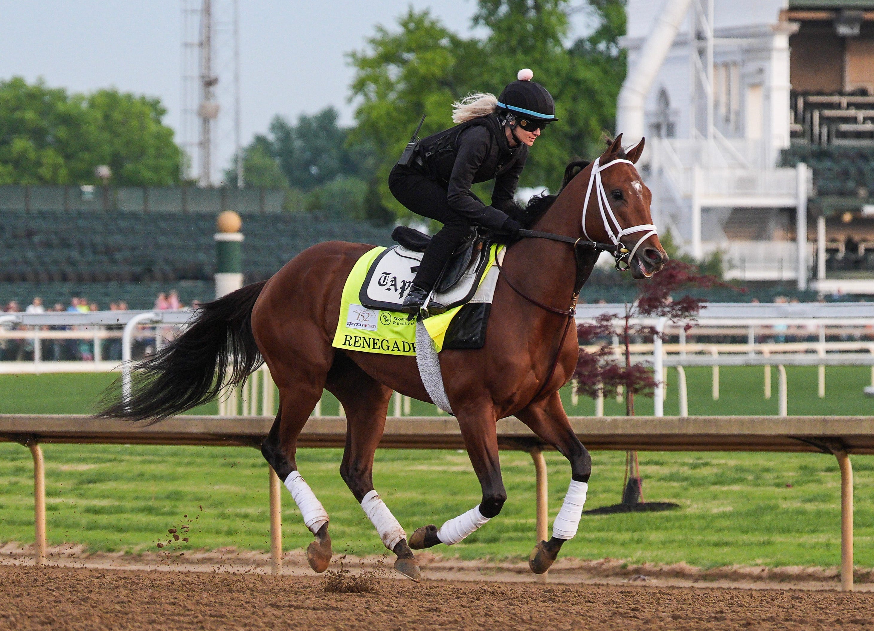2026 Kentucky Derby horse and morning line 4-1 favorite Renegade with exercise rider Nora McCormack works at Churchill Downs in Louisville, Kentucky. Renegade was raced five times, winning twice with multiple finishes with around $1 million in earnings.