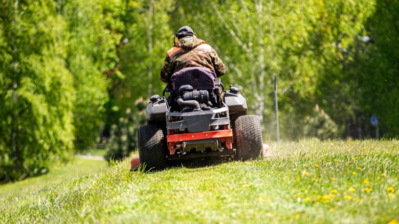 Man mowing his lawn on a rider mower