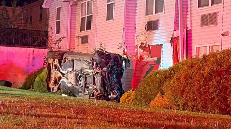 Driver hospitalized after car hits senior living complex