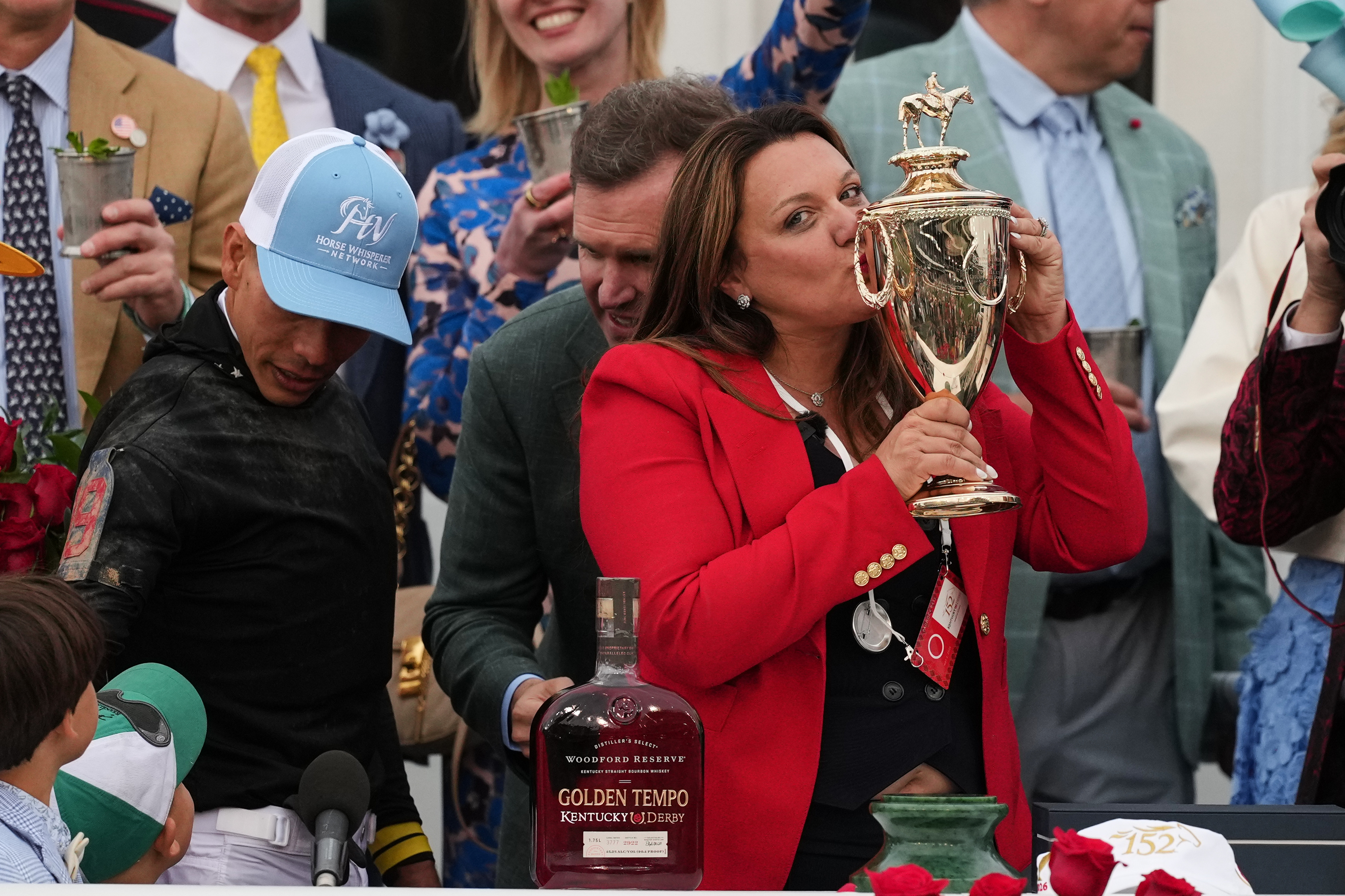 Trainer Cherie DeVaux kisses the trophy after a victory by Golden Tempo in the 152nd running of the Kentucky Derby horse race at Churchill Downs, Saturday, May 2, 2026, in Louisville, Ky. (AP Photo/Abbie Parr)