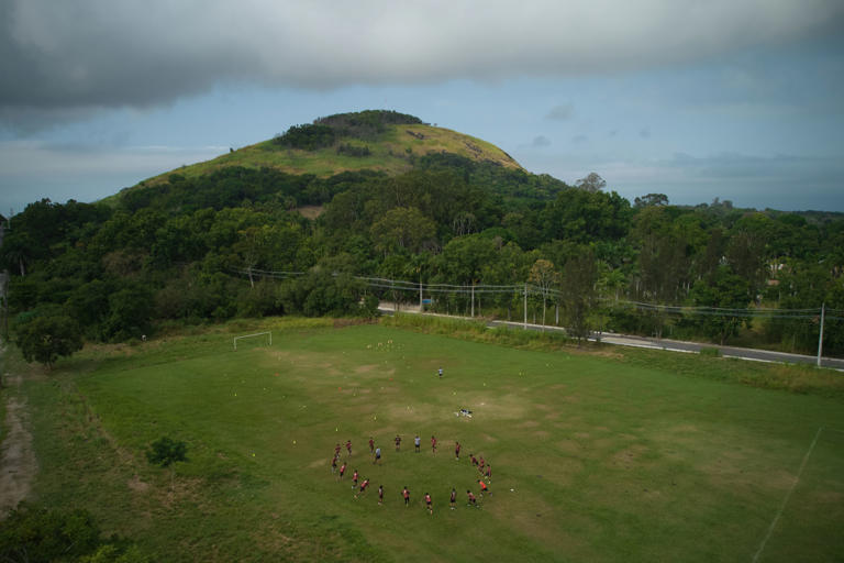 Members of Originarios, a new soccer team in Rio's fifth division made up exclusively of Indigenous players, train in Marica, Brazil, Tuesday, April 28, 2026. (AP Photo/Silvia Izquierdo)