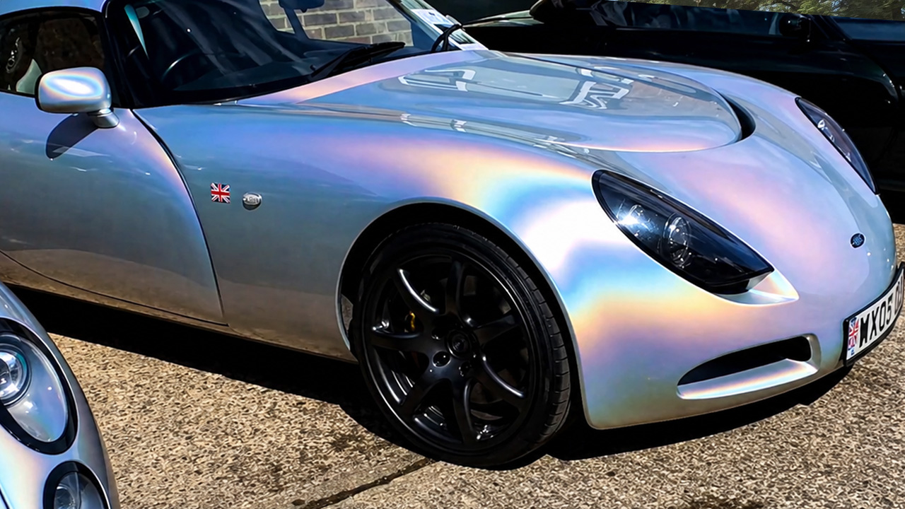 Stunning pearlescent car on a scenic European road trip