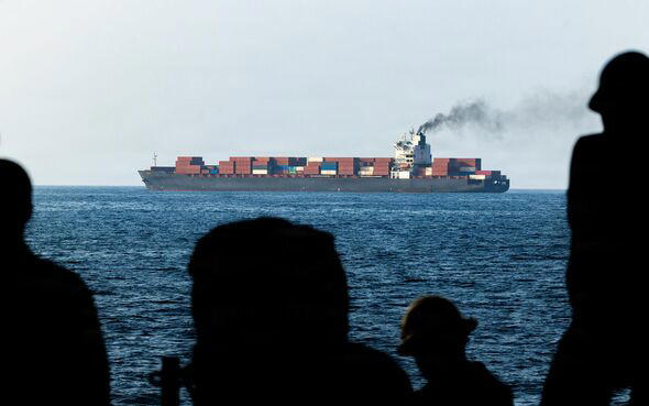 Cargo ship attacked near Strait of Hormuz as armed boats swarm vessel