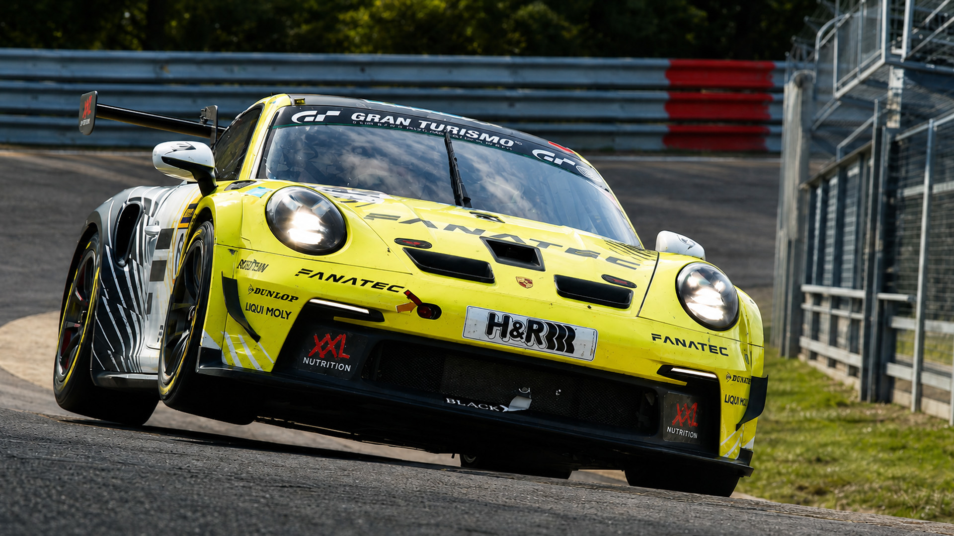 Porsche GT3 pushes hard through tight circuit corner
