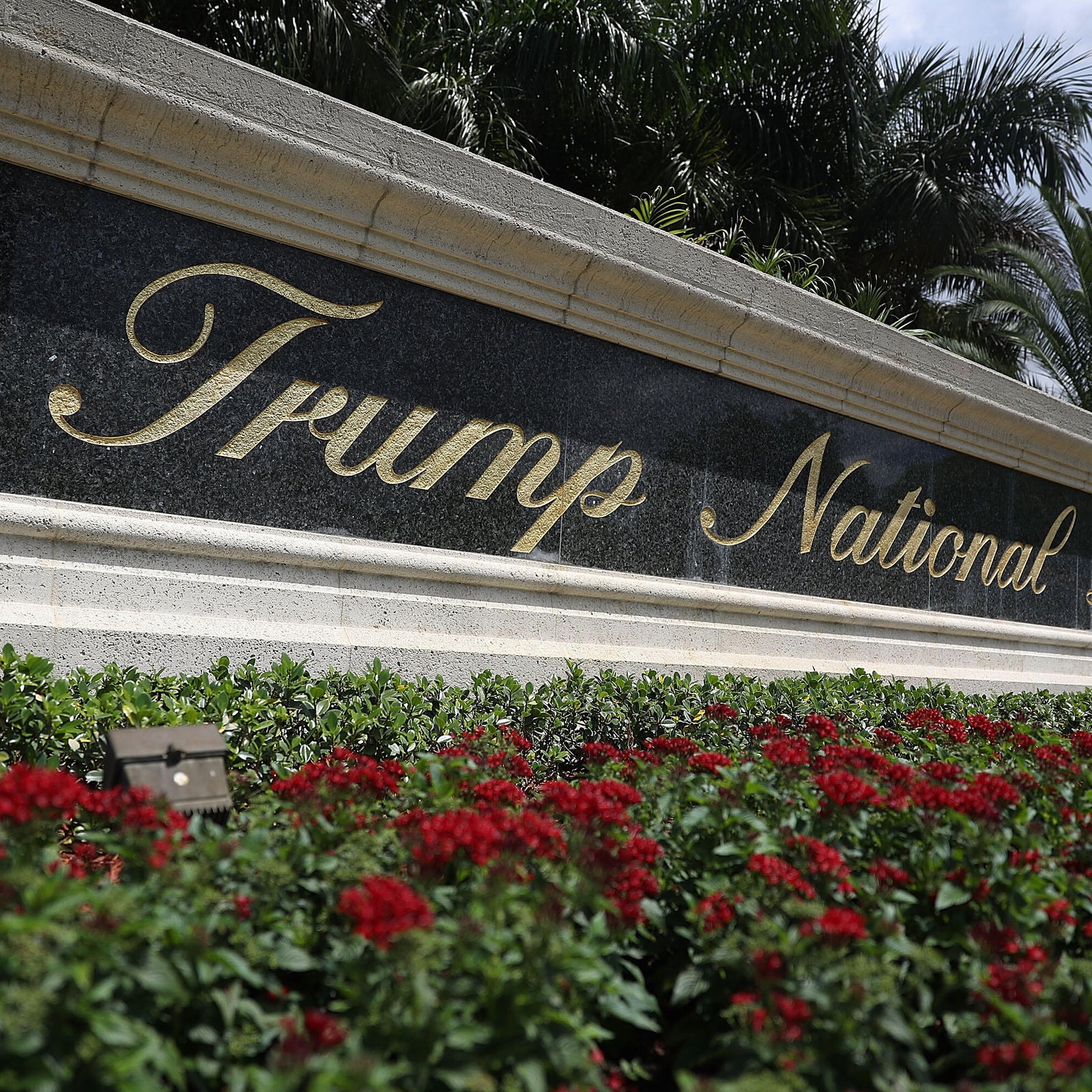 A sign reading Trump National Doral is seen on the grounds of the golf course owned by Republican presidential candidate Donald Trump on June 1, 2016 in Doral, Florida.