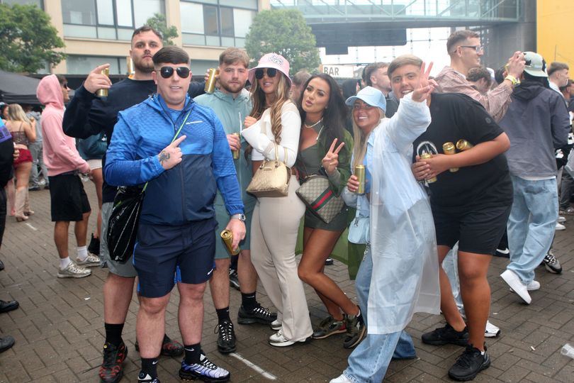 Raving in the rain in 18 photos as thousands pack out second day of ...