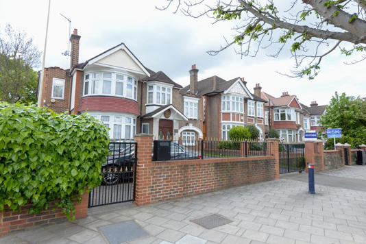 The embassy blends in with the rest of the houses on the street