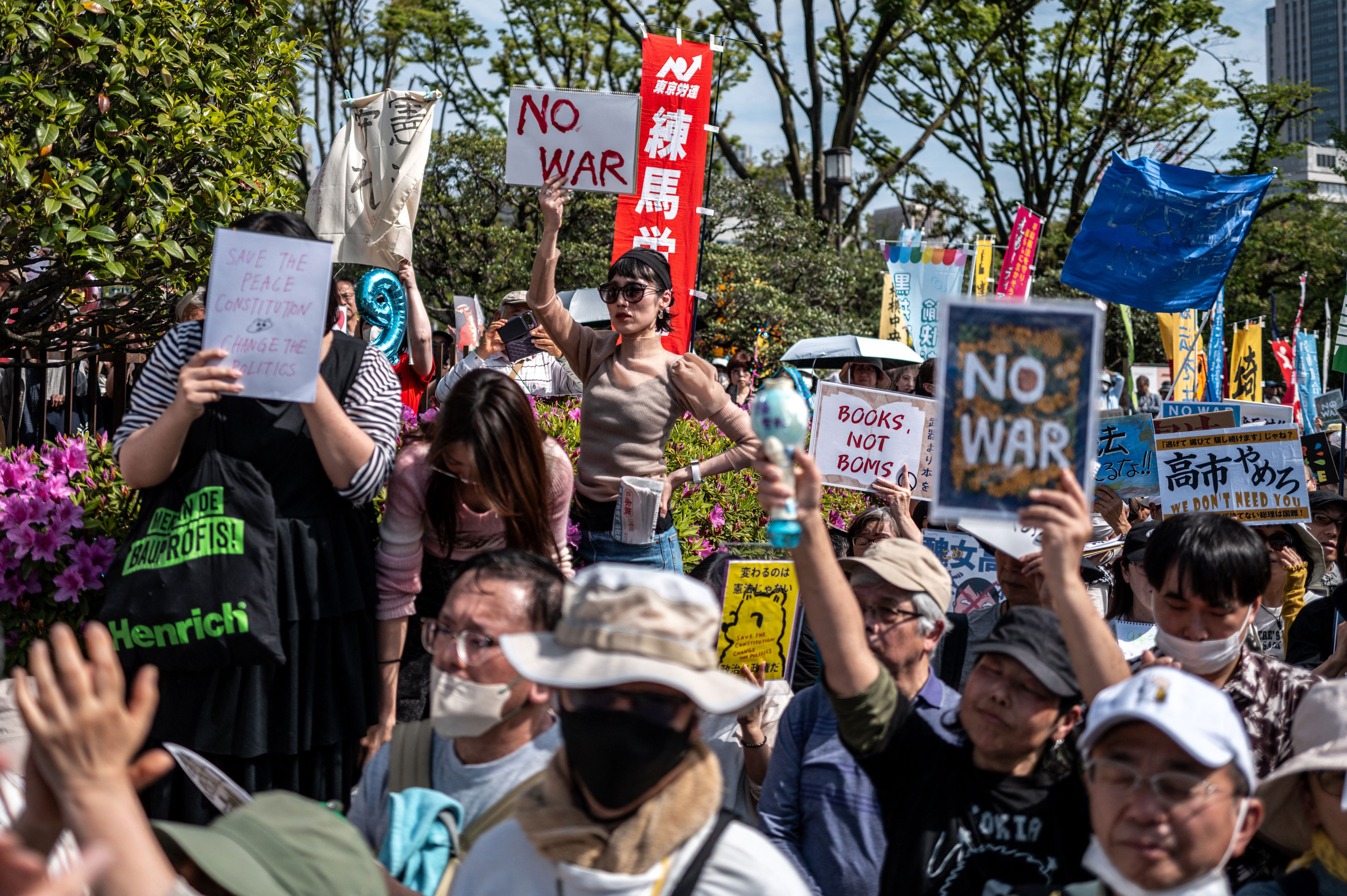 Japan sees largest ever protest in support of pacifist constitution