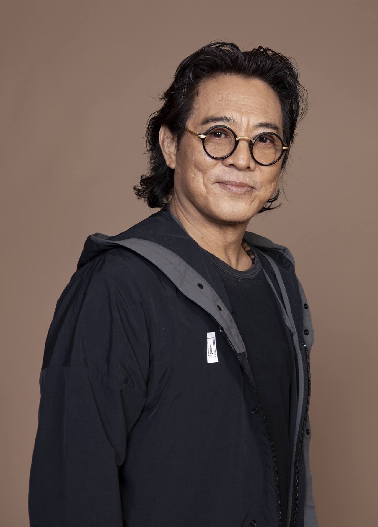 Jet Li exercises with tai chi and ping-pong