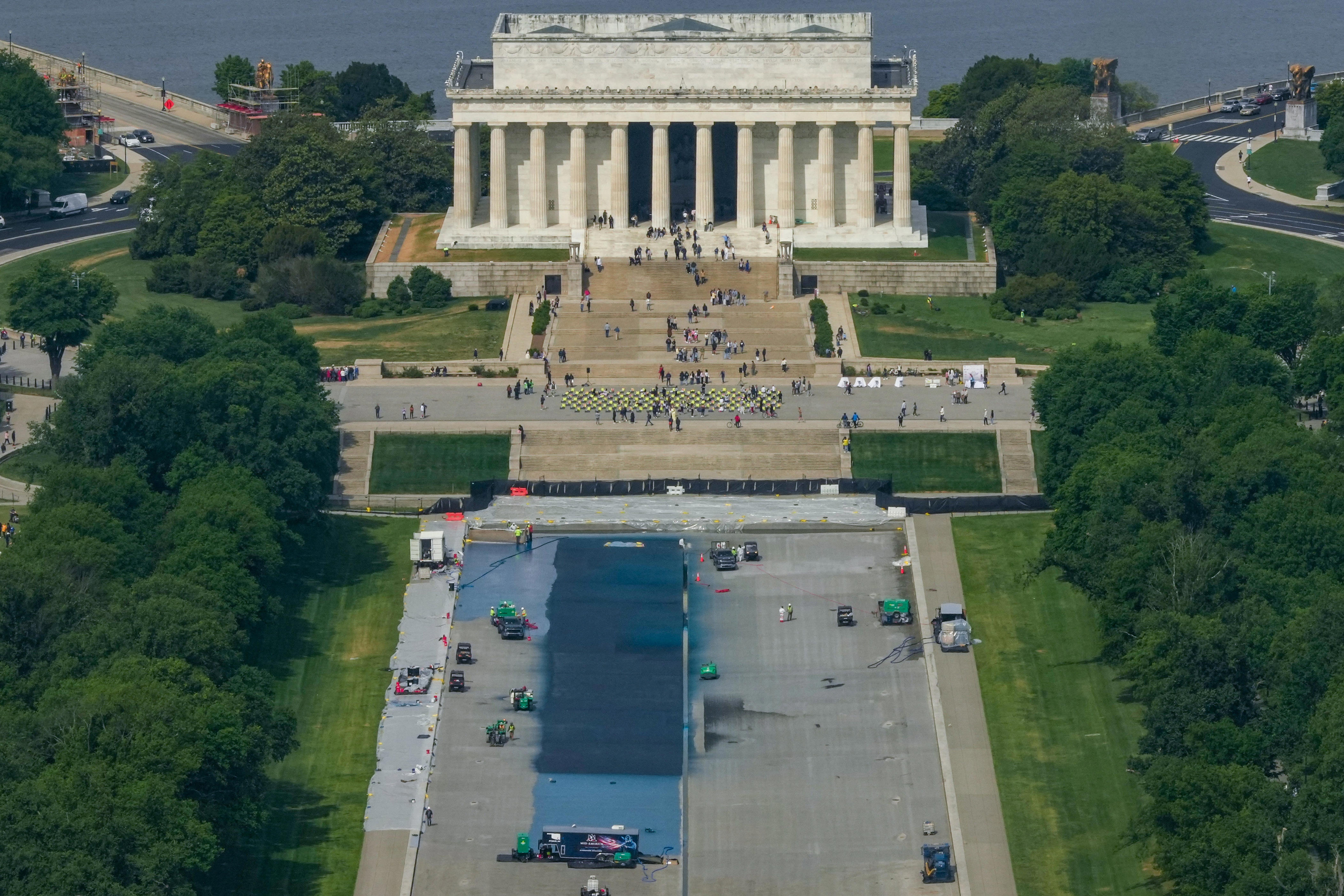 A general view from the Washington Monument of the Lincoln Memorial as workers continue renovations on the Reflecting Pool, which is painted blue, in Washington, D.C., U.S., May 2, 2026.