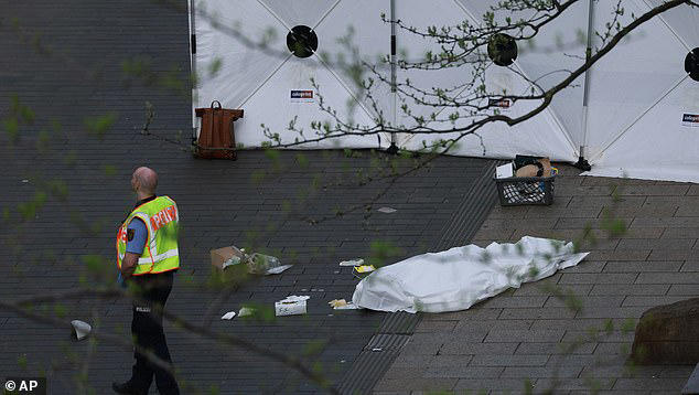 Woman and man are dead and 20 are hurt after car ploughs into crowd in ...