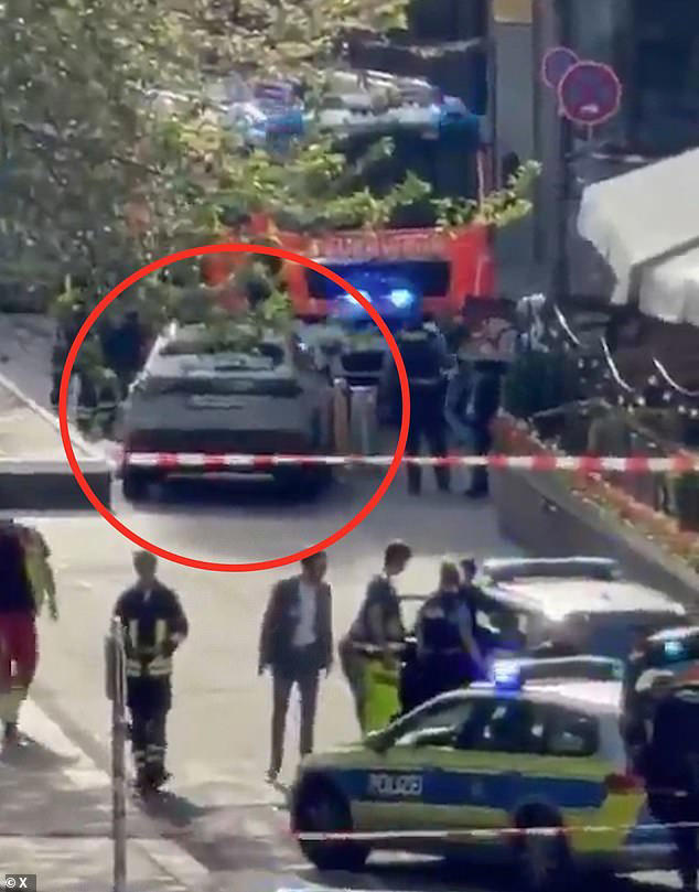 Woman and man are dead and 20 are hurt after car ploughs into crowd in ...