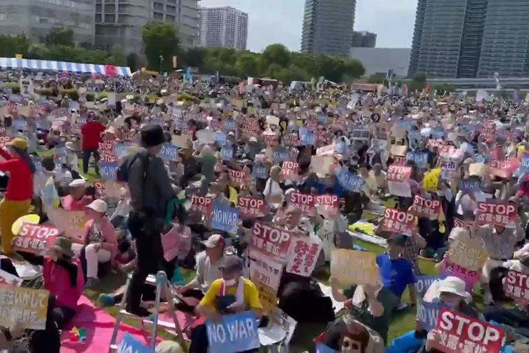 Japan sees largest ever protest in support of pacifist constitution