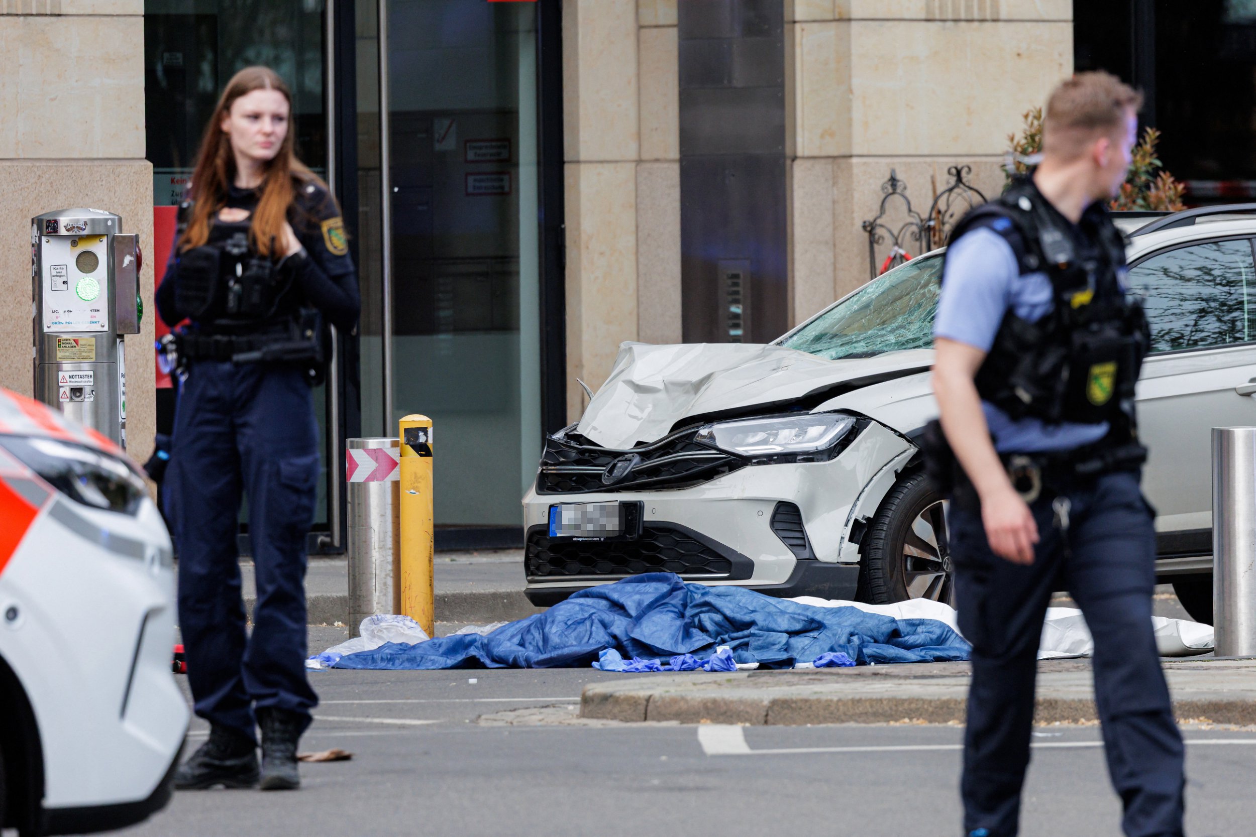 Two dead and at least 20 injured after car ploughs into crowd in German ...