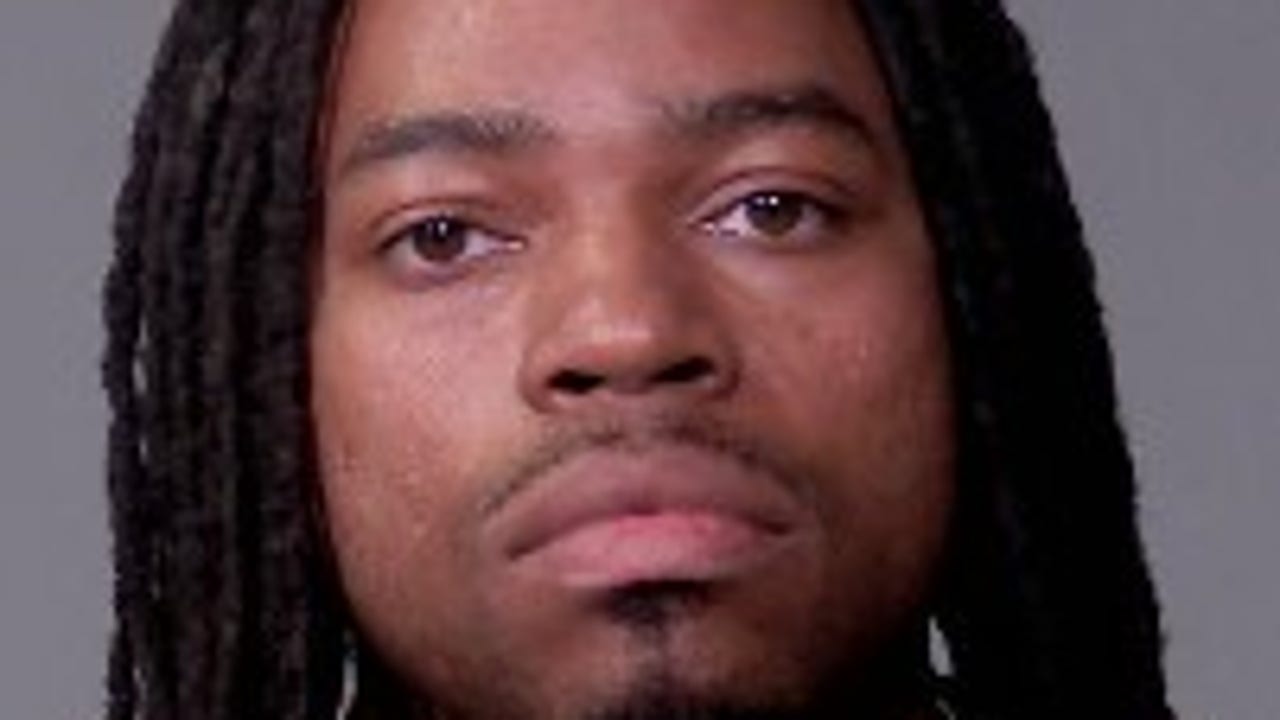 Man charged after police recover drugs, stolen gun in Joliet raid