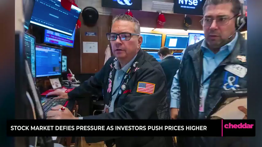 Stock market defies pressure as investors push prices higher