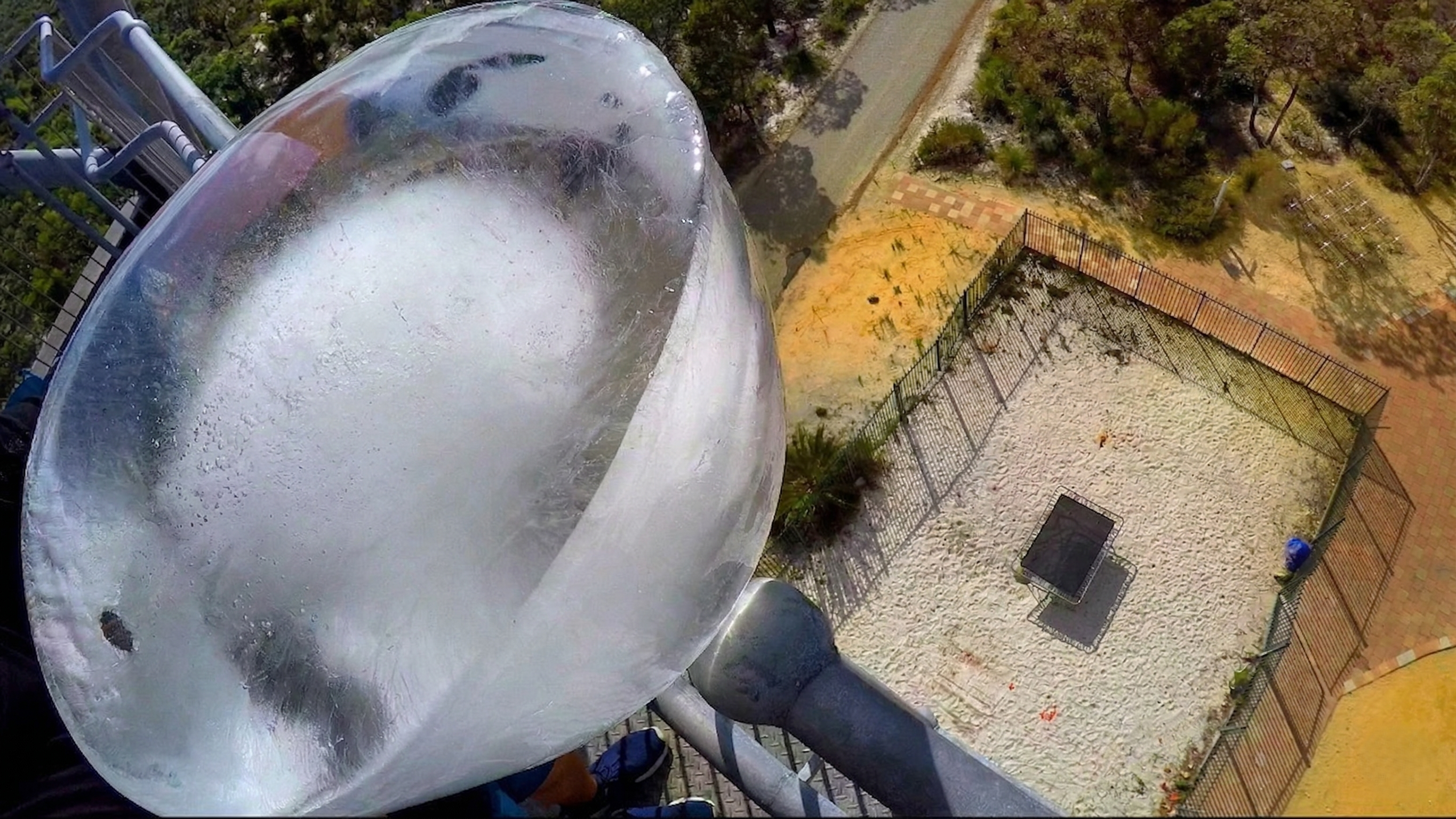 Watch what happens when a giant ice block is dropped on a trampoline ...