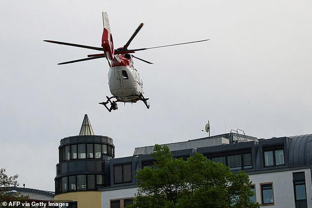 Woman and man are dead and 20 are hurt after car ploughs into crowd in ...