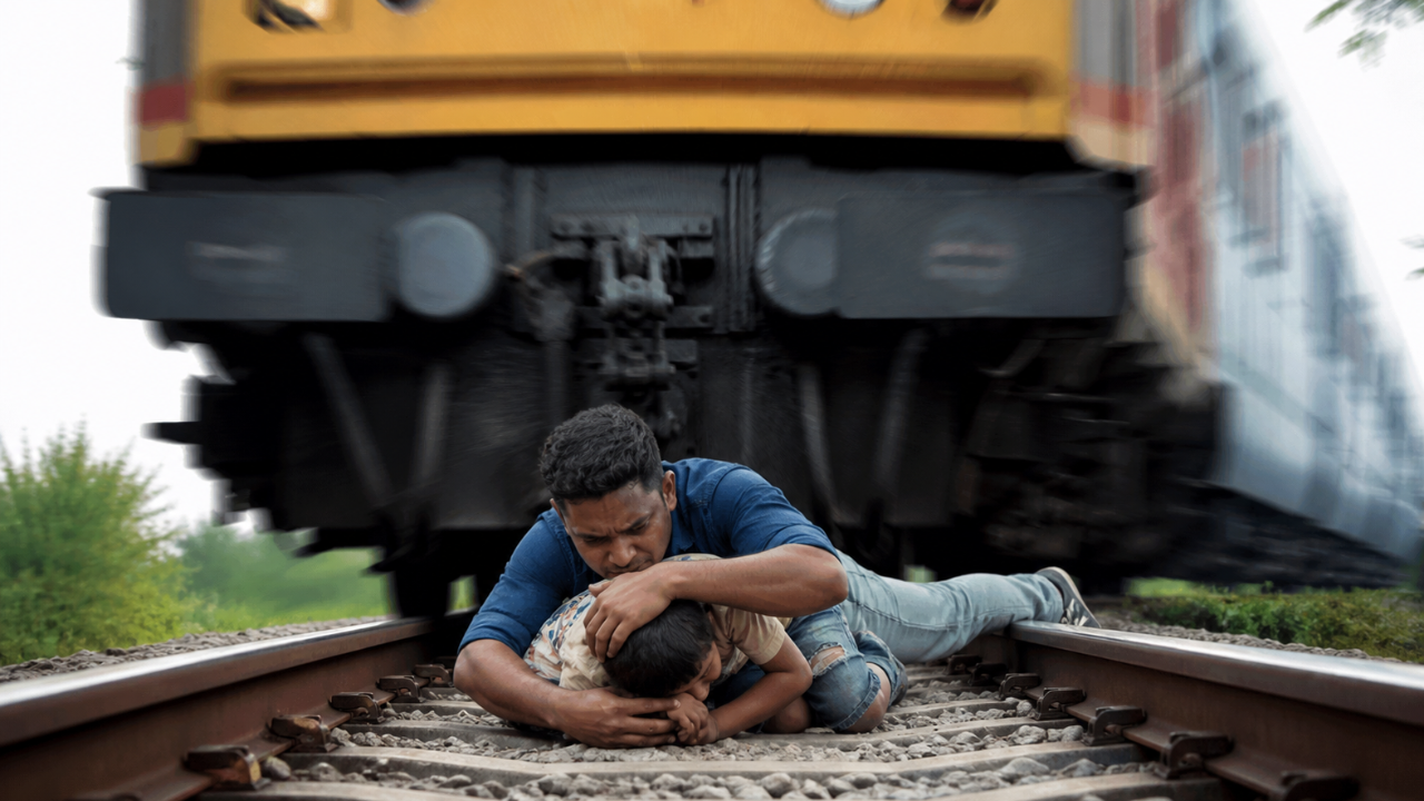 Viral: Man leaps onto railway track to save son as train passes overhead