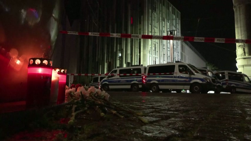 Mourners lay flowers and candles in Leipzig after deadly car rampage
