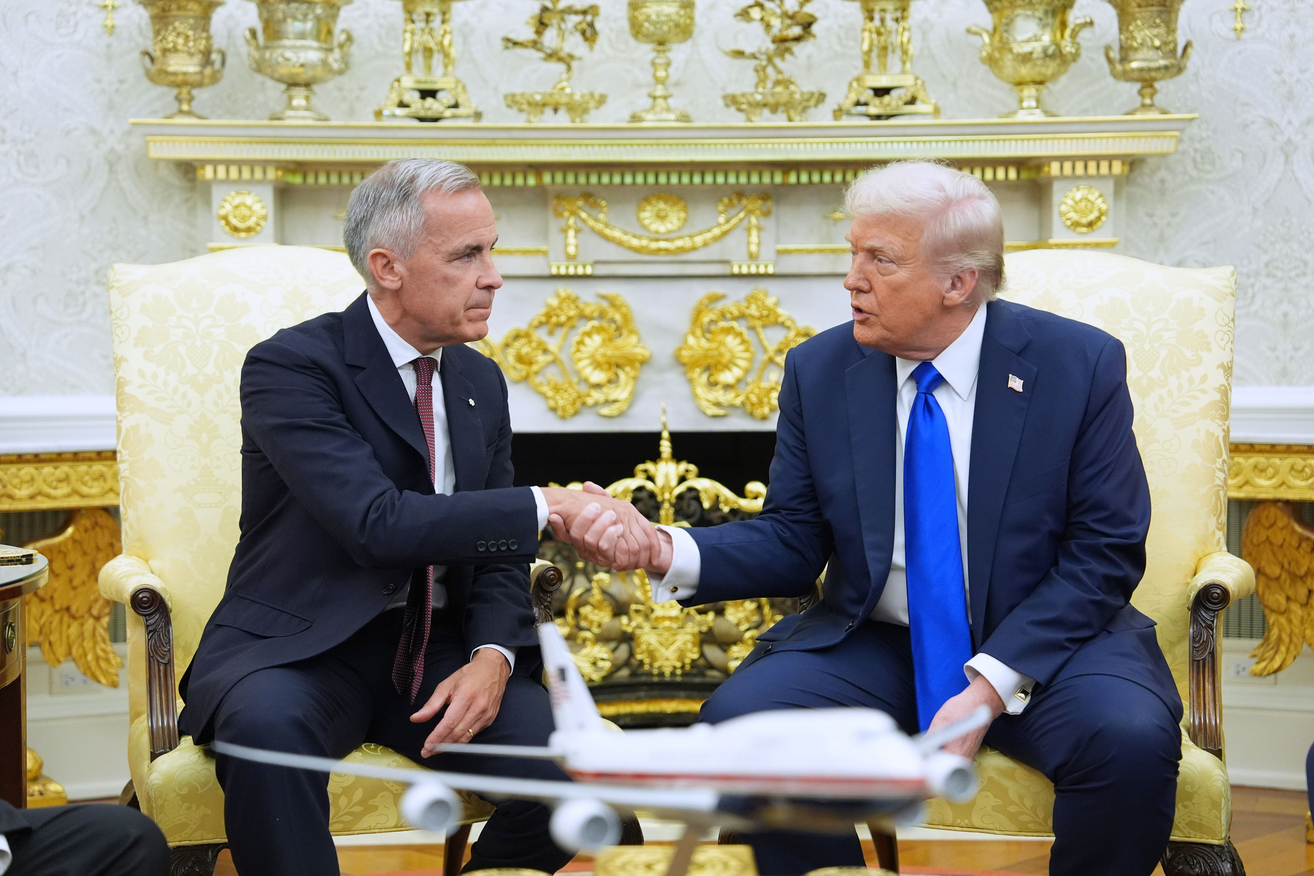 President Donald Trump greets Canadian Prime Minister Mark Carney in the Oval Office of the White House in Washington, on Oct. 7, 2025.