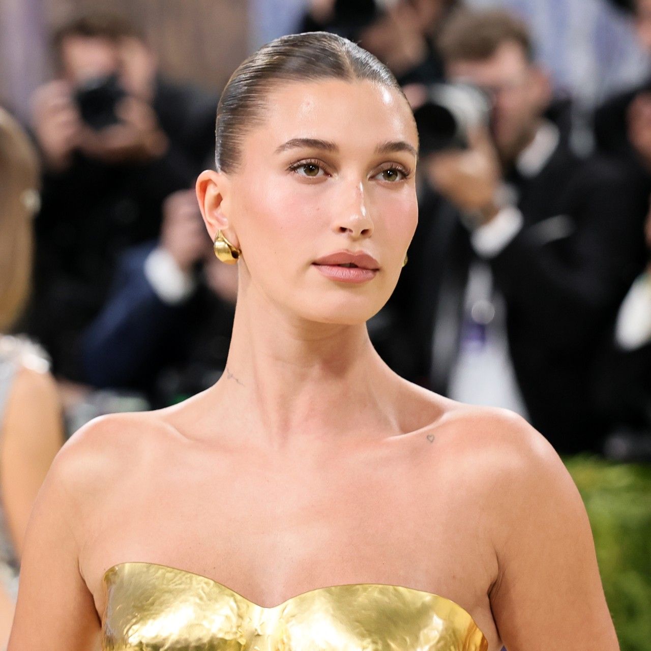 Hailey Bieber's goddess bun is just as intentional as her 24K-gold ...