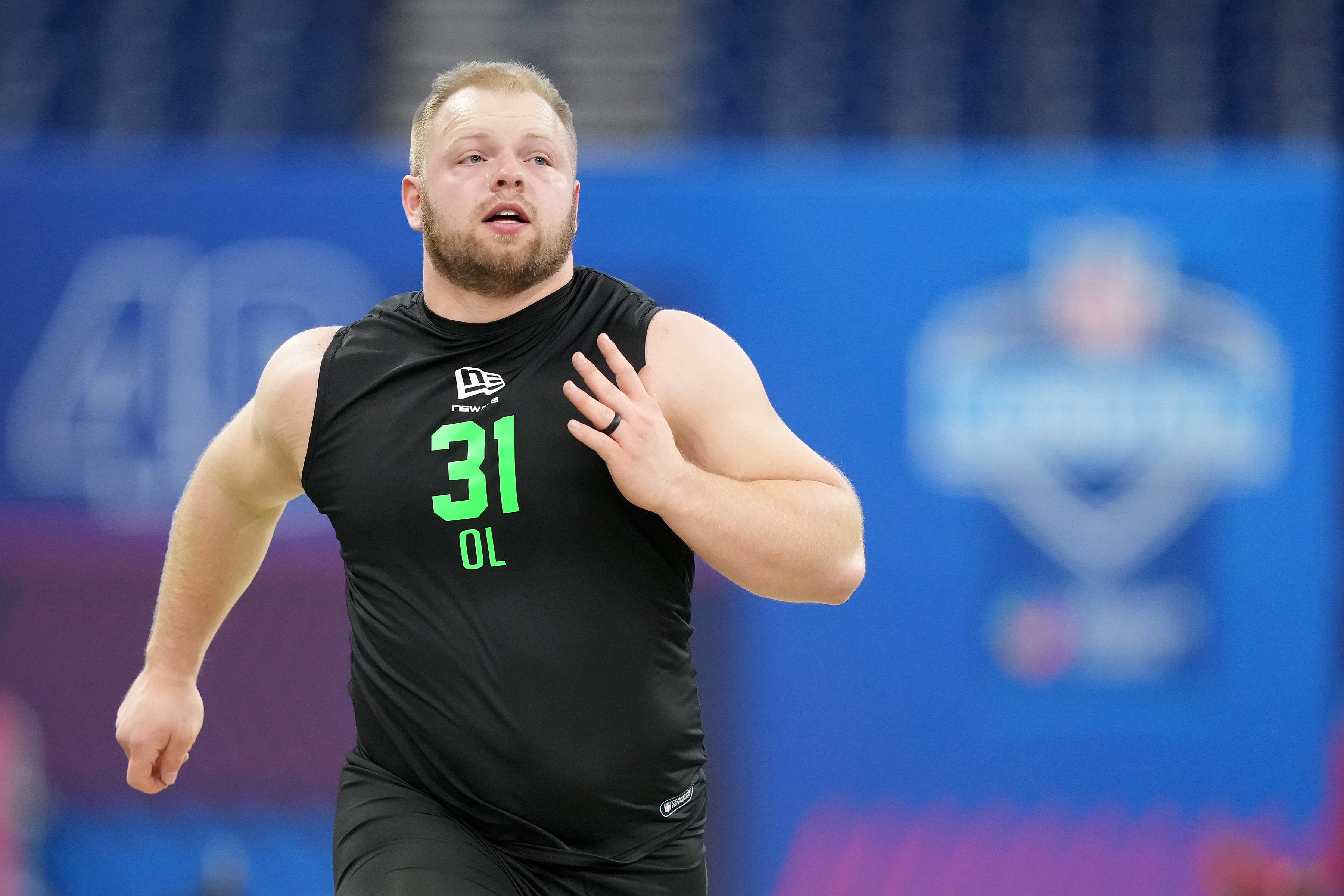 Rookie center is motivated to make things easier for Caleb Williams