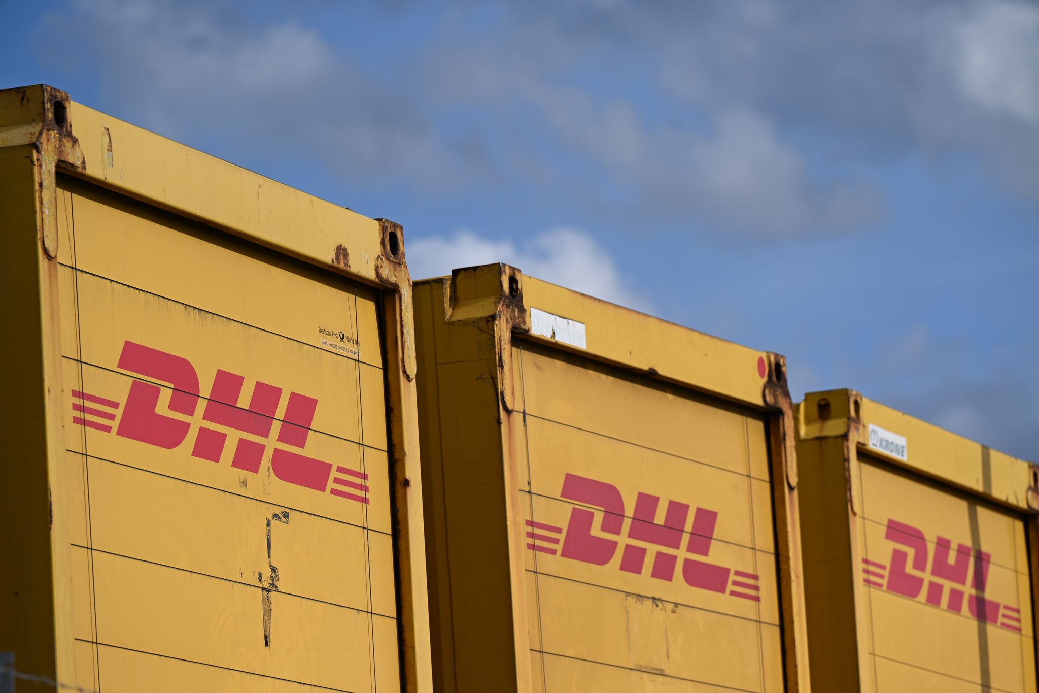 Deutsche Post delivers a name change as letters fade, turning into DHL