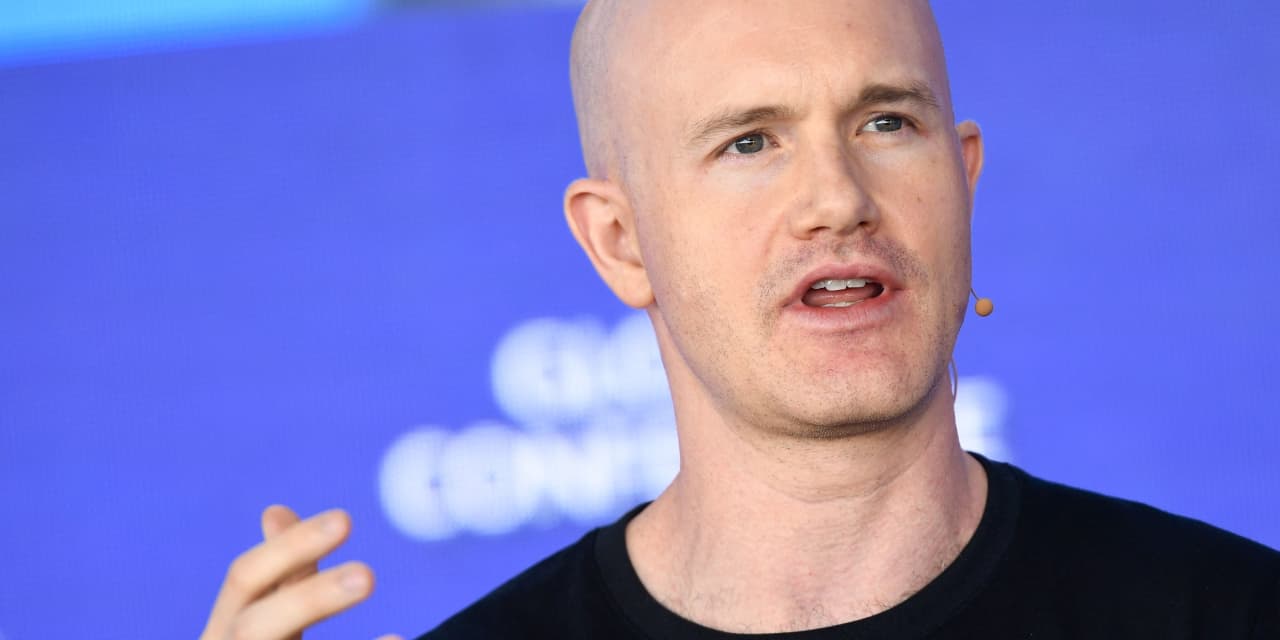 Coinbase will lay off 14% of its staff as AI spurs a new way of working