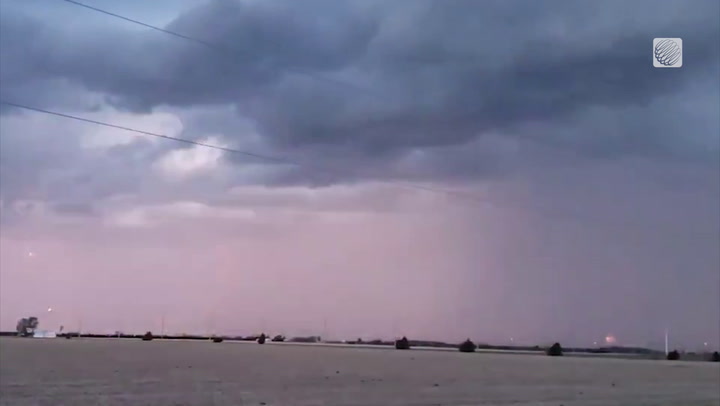 Lightning strikes and dark storm clouds over Tilbury, Ontario
