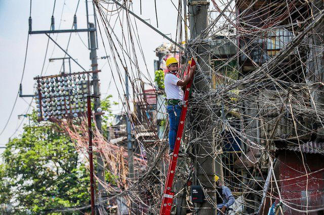 Truck pulls down power lines, topples electric post