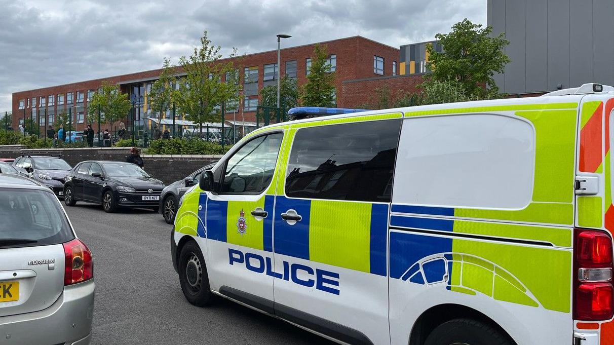 School locked down as armed police arrest man