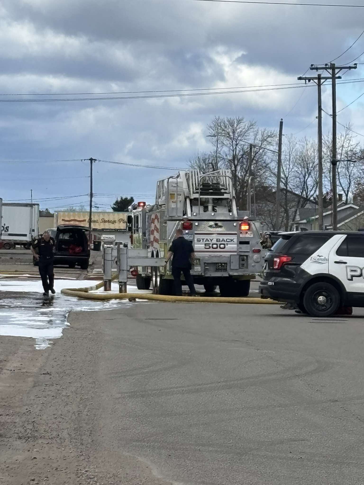 Crews work to put out garbage truck fire in Escanaba