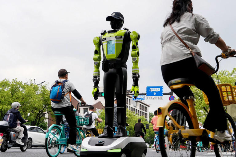 China’s robots step into real-world roles, from cleaning to directing ...
