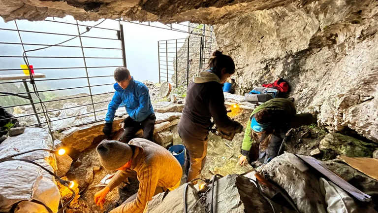 Archaeologists unearth mysterious green rocks in Pyrenees cave ...