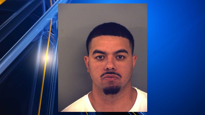 Man arrested after child found alone in parking lot