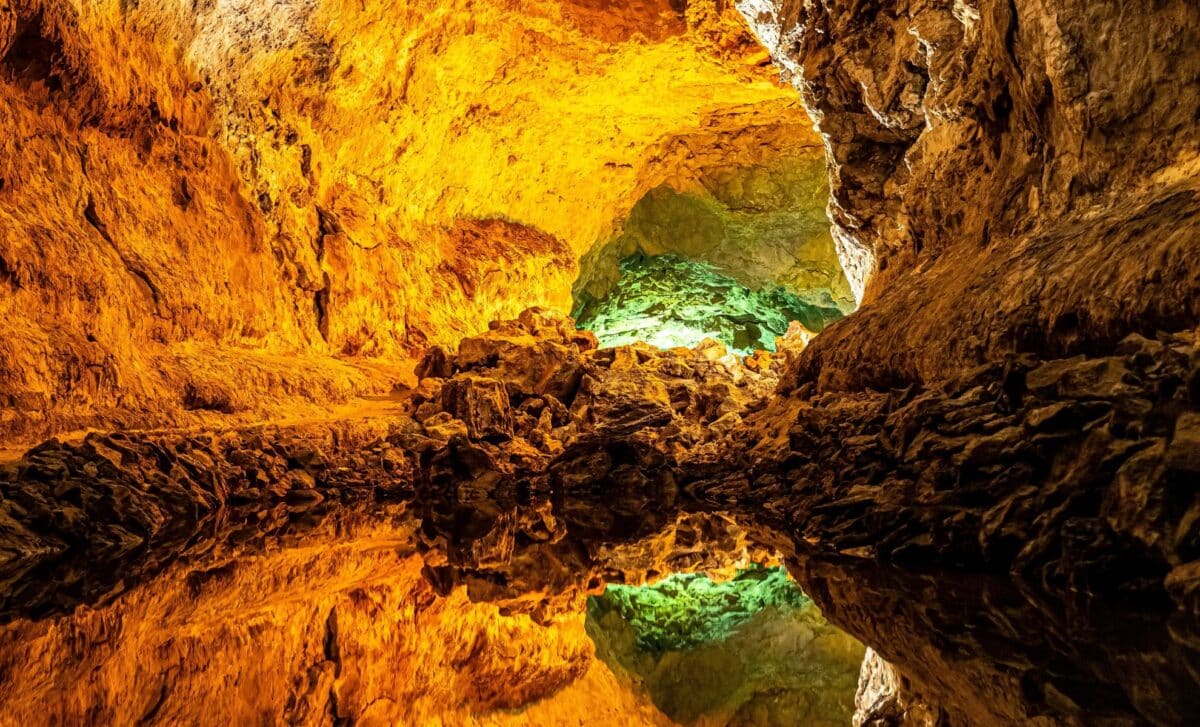 Archaeologists unearth mysterious green rocks in Pyrenees cave ...
