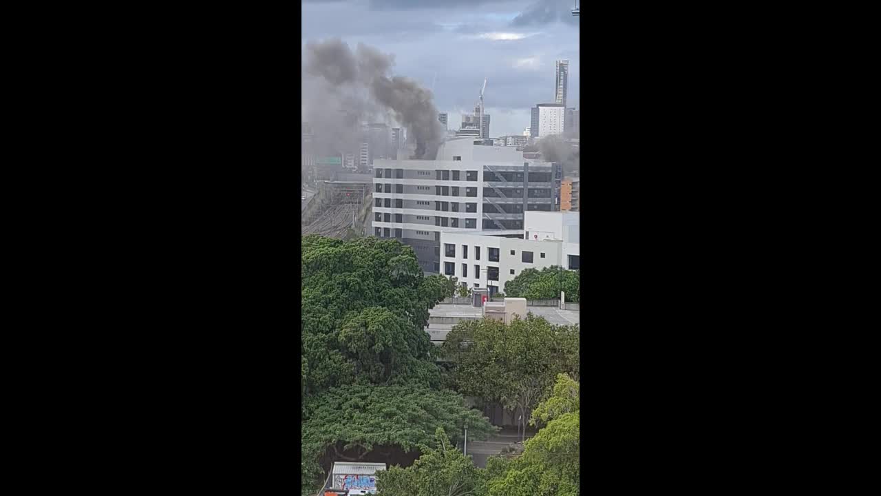 Fire erupts on top floor of office building in Brisbane
