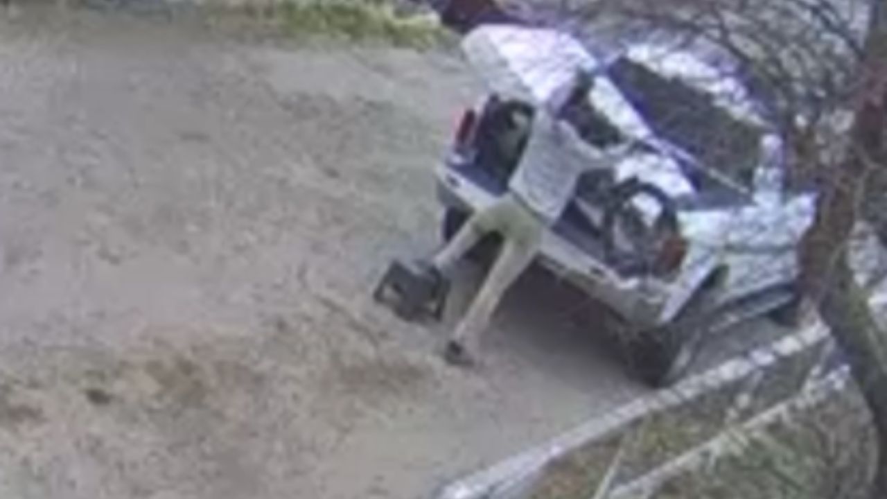 Man struggles as an e-bike jumps forward during unload