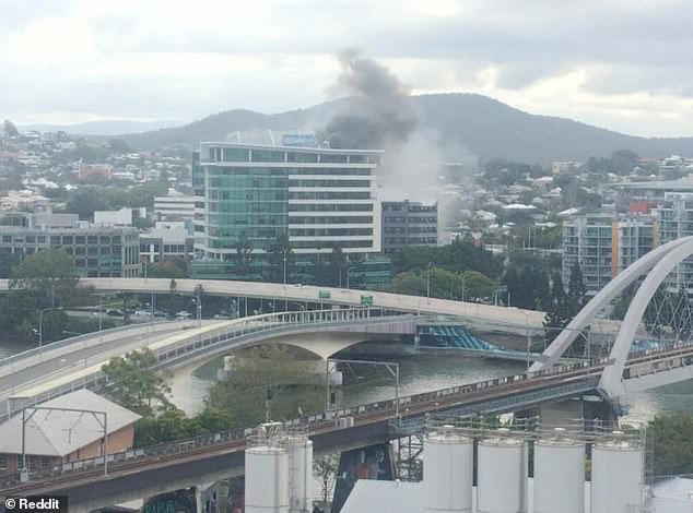 Huge fire breaks out in office building in Brisbane: Person trapped on ...