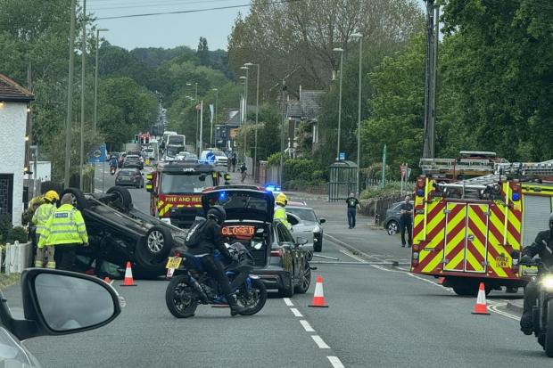 Everything we know after car flipped onto roof in crash on busy road