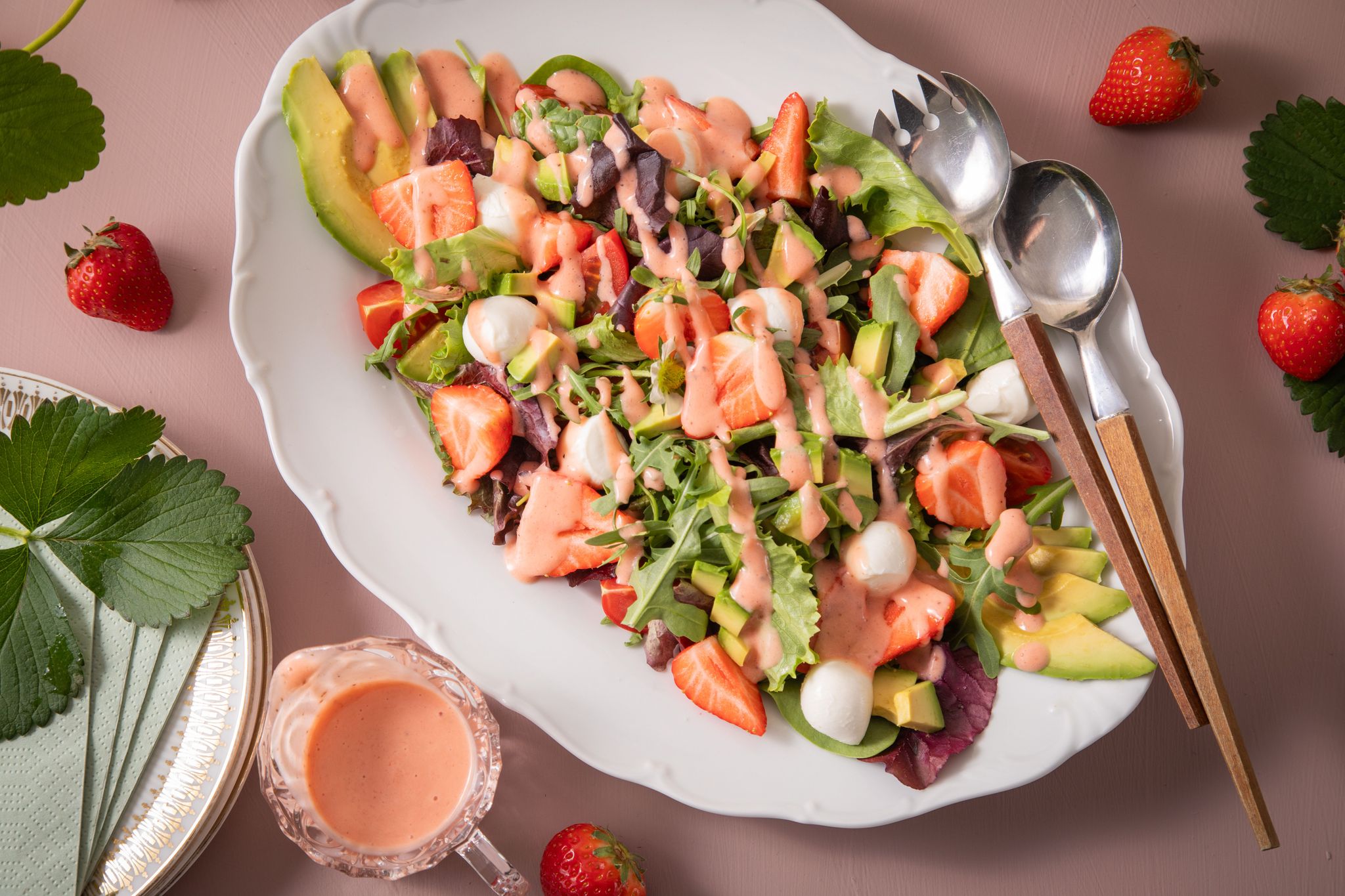 Sweet and crunchy salad with strawberry dressing - plus blue flowers
