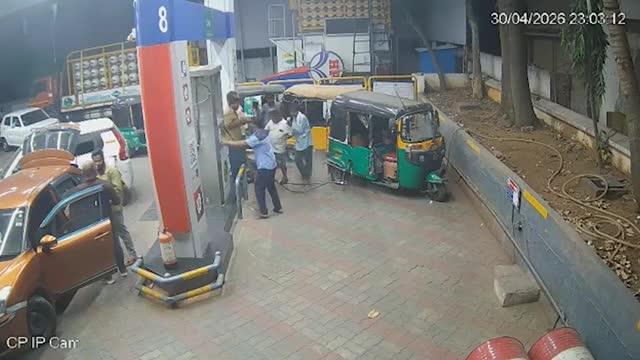 Workers and motorists flee as two auto rickshaws catch fire at petrol ...