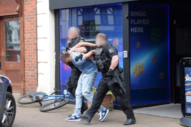Armed police arrest man on suspicion of threats to kill and possessing ...