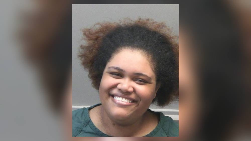 Woman charged after shots fired into home