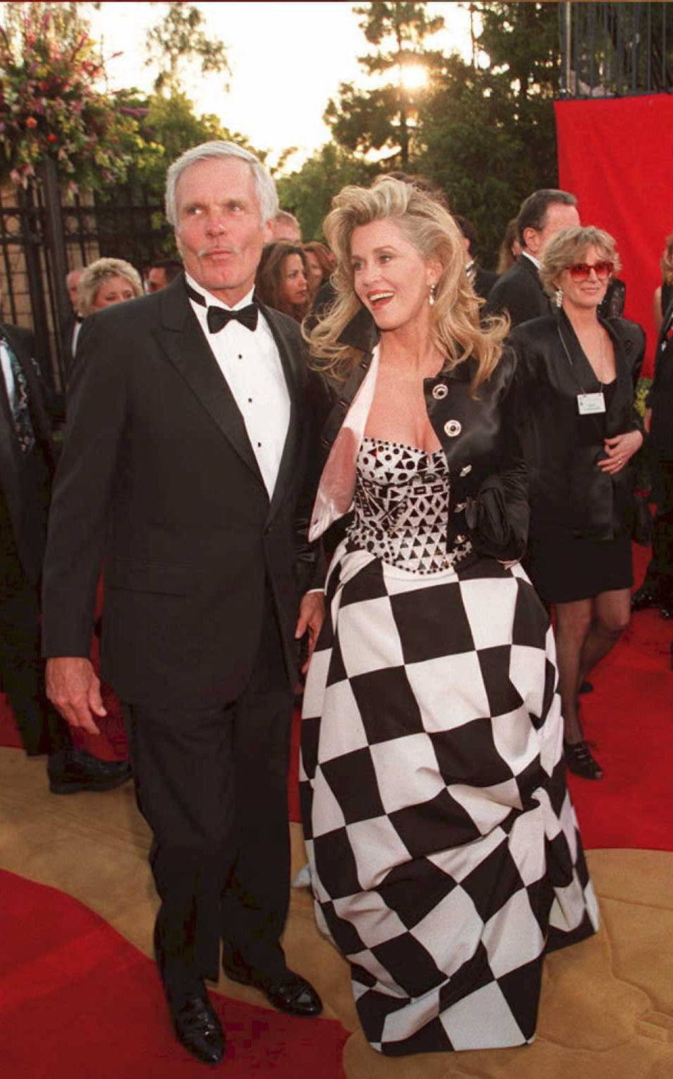 Actress Jane Fonda (R) arrives with her husband Ted Turner for the 67th annual Academy Awards in Los Angeles in 1995. Fonda has won an Oscar for her film work and Turner is the head of Turner Enterprises.